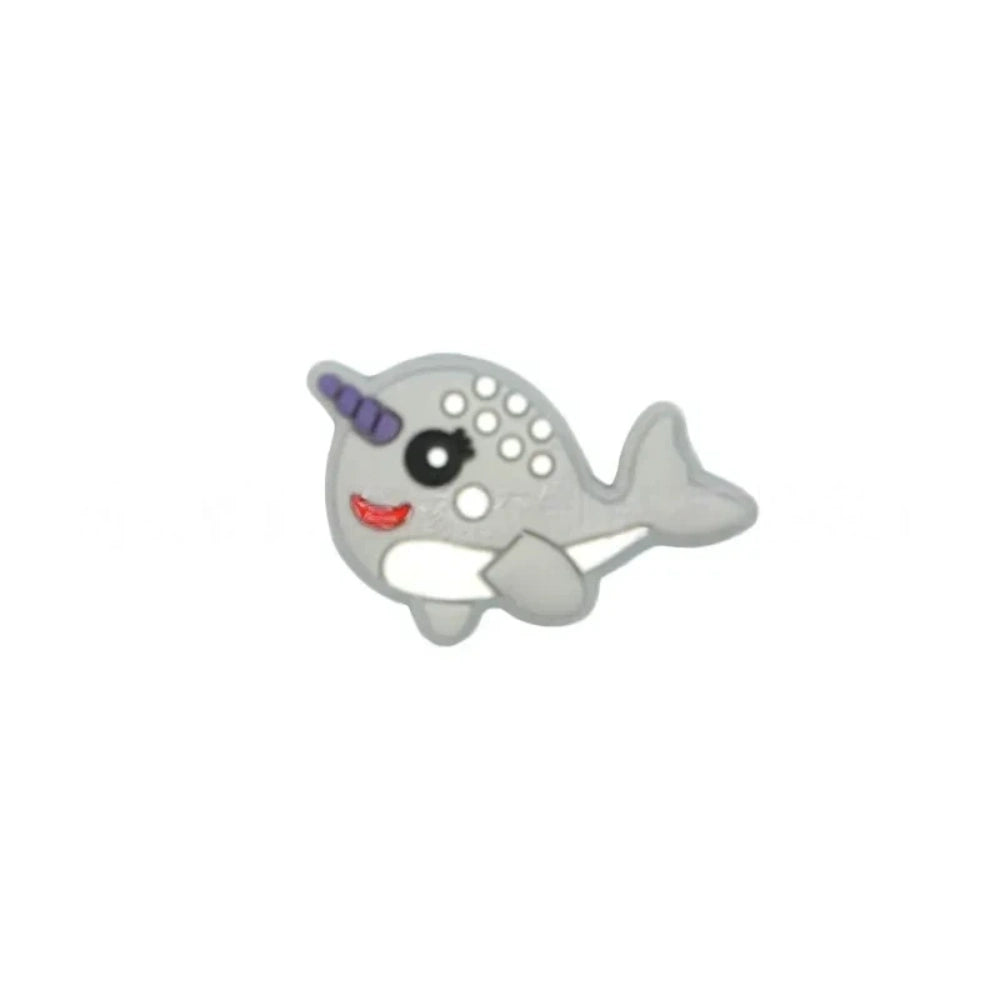 Set of 5 kawaii narwhal silicone focal beads in teal, mint, pink, light blue, gray, and dark gray, displayed on a miniature white bench with blue background. - 6