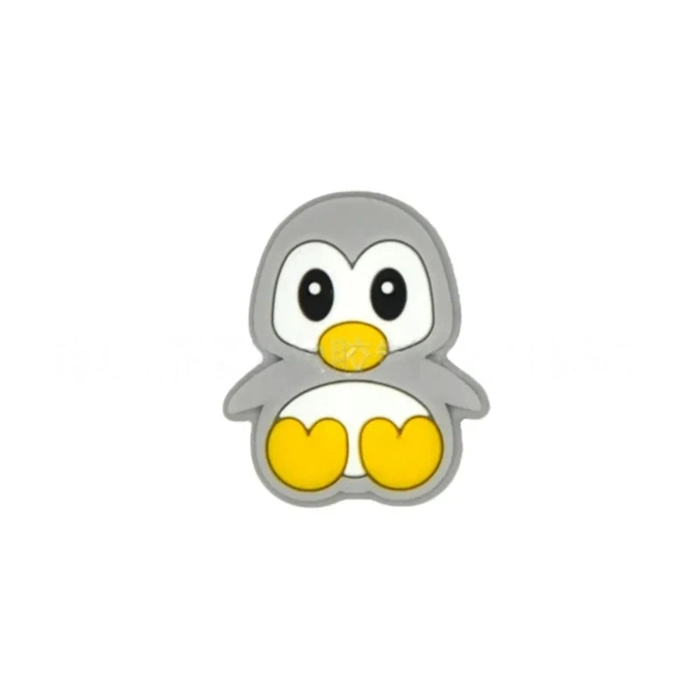 Assorted color cute cartoon penguin silicone focal beads in black, pink, gray, blue, and mint green on a light blue background, perfect for beadable pens, keychains, and badge reels. - 1