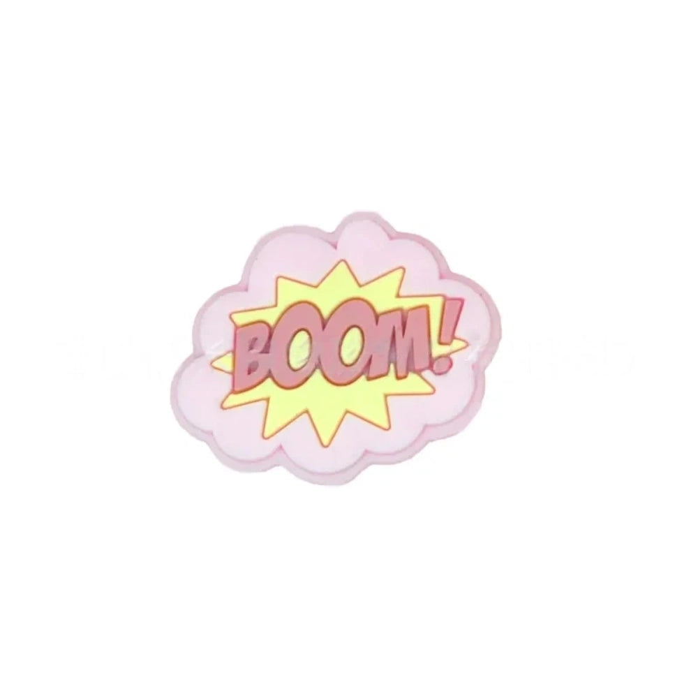 Colorful POW, BOOM, and ZAP superhero comic book silicone focal beads in blue, yellow, and light blue displayed on a white shell dish, perfect for beadable pens, keychains, and badge reels. - 1