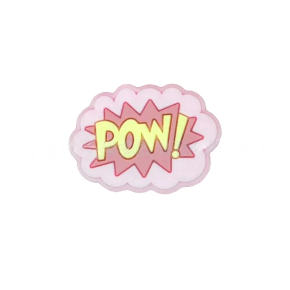 Colorful POW, BOOM, and ZAP superhero comic book silicone focal beads in blue, yellow, and light blue displayed on a white shell dish, perfect for beadable pens, keychains, and badge reels. - 2