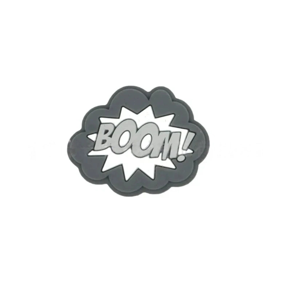 Colorful POW, BOOM, and ZAP superhero comic book silicone focal beads in blue, yellow, and light blue displayed on a white shell dish, perfect for beadable pens, keychains, and badge reels. - 4