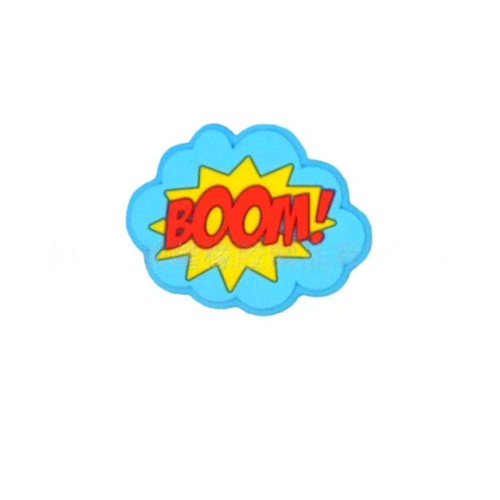 Colorful POW, BOOM, and ZAP superhero comic book silicone focal beads in blue, yellow, and light blue displayed on a white shell dish, perfect for beadable pens, keychains, and badge reels. - 6