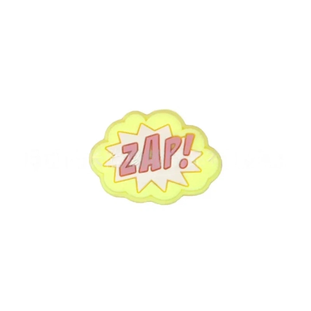 Colorful POW, BOOM, and ZAP superhero comic book silicone focal beads in blue, yellow, and light blue displayed on a white shell dish, perfect for beadable pens, keychains, and badge reels. - 9
