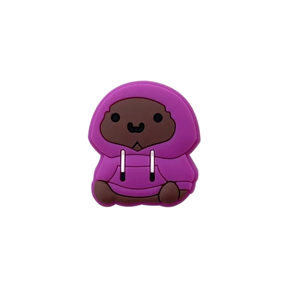 Four purple hoodie bear silicone focal beads in varying skin tones, sitting pose, displayed on a miniature white wooden bench with yellow background. - 1