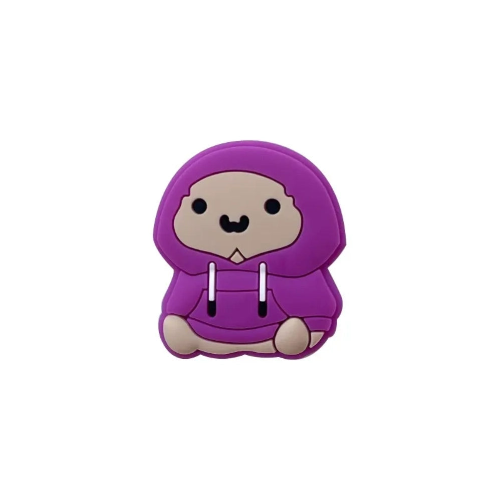 Four purple hoodie bear silicone focal beads in varying skin tones, sitting pose, displayed on a miniature white wooden bench with yellow background. - 4