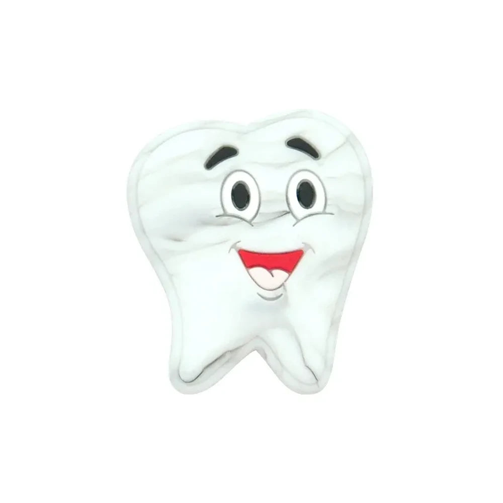 Assorted pastel smiling tooth shaped silicone focal beads in white, pink, blue, green, and gray with cartoon faces, strung on cord and displayed in a white tray on a blue background. - Marble