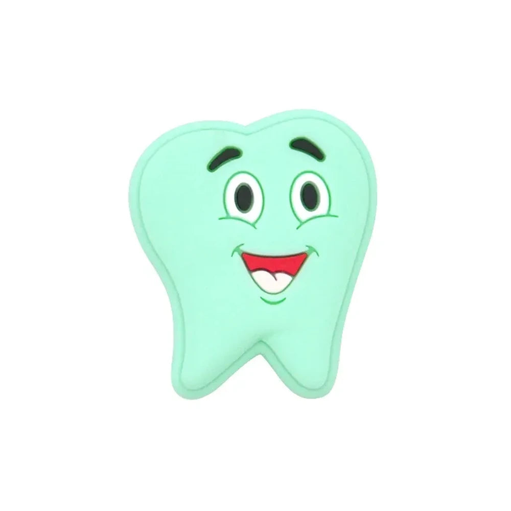 Assorted pastel smiling tooth shaped silicone focal beads in white, pink, blue, green, and gray with cartoon faces, strung on cord and displayed in a white tray on a blue background. - Mint Green
