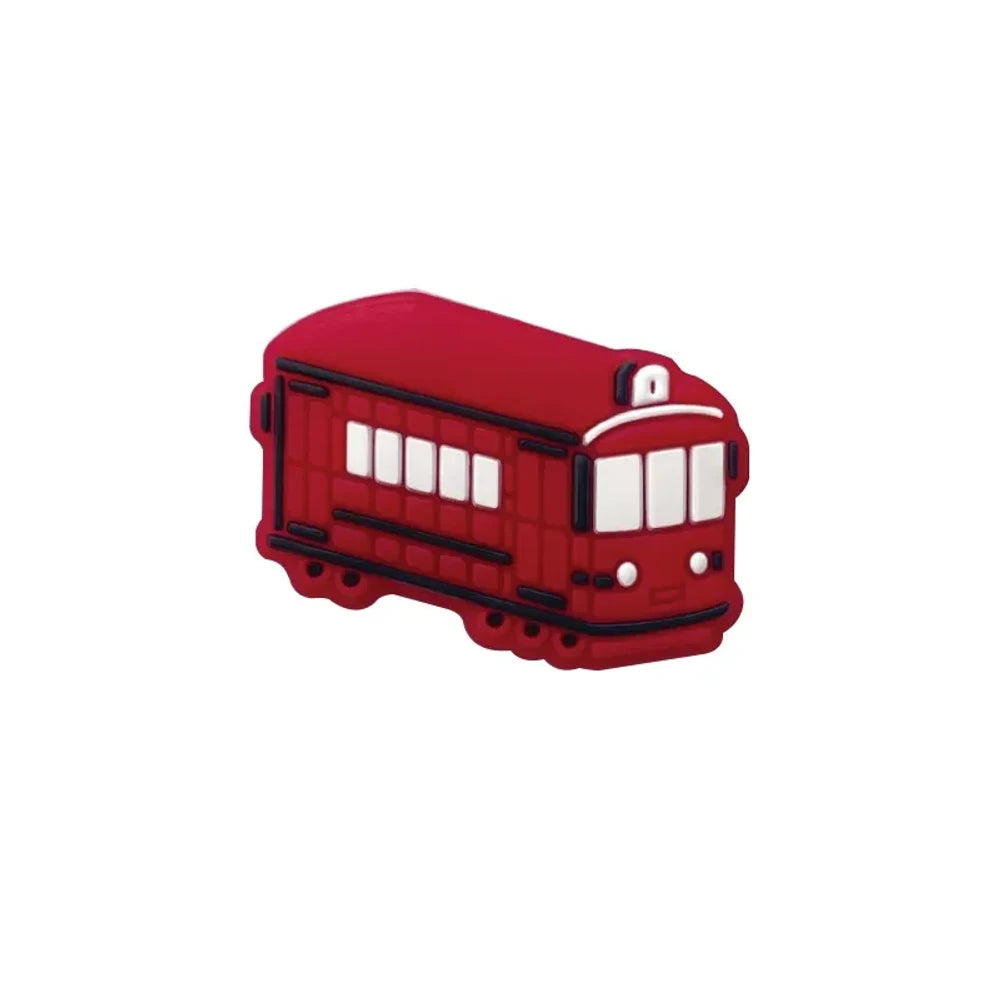 Four colorful silicone tram streetcar focal beads in blue, yellow, red, and green displayed on a pink background with miniature versions shown in a white dish above. - Red
