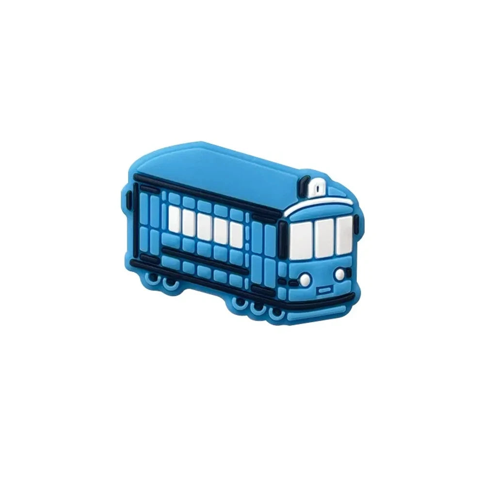 Four colorful silicone tram streetcar focal beads in blue, yellow, red, and green displayed on a pink background with miniature versions shown in a white dish above. - Sky Blue