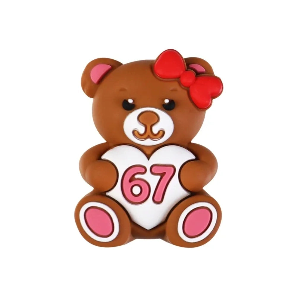 Assorted Valentine's Day silicone focal beads featuring teddy bears holding 67 hearts, highland cows with red bows, heart-shaped sunglasses, gnomes, and SIX SEVEN heart beads in red and pink tones - Bear