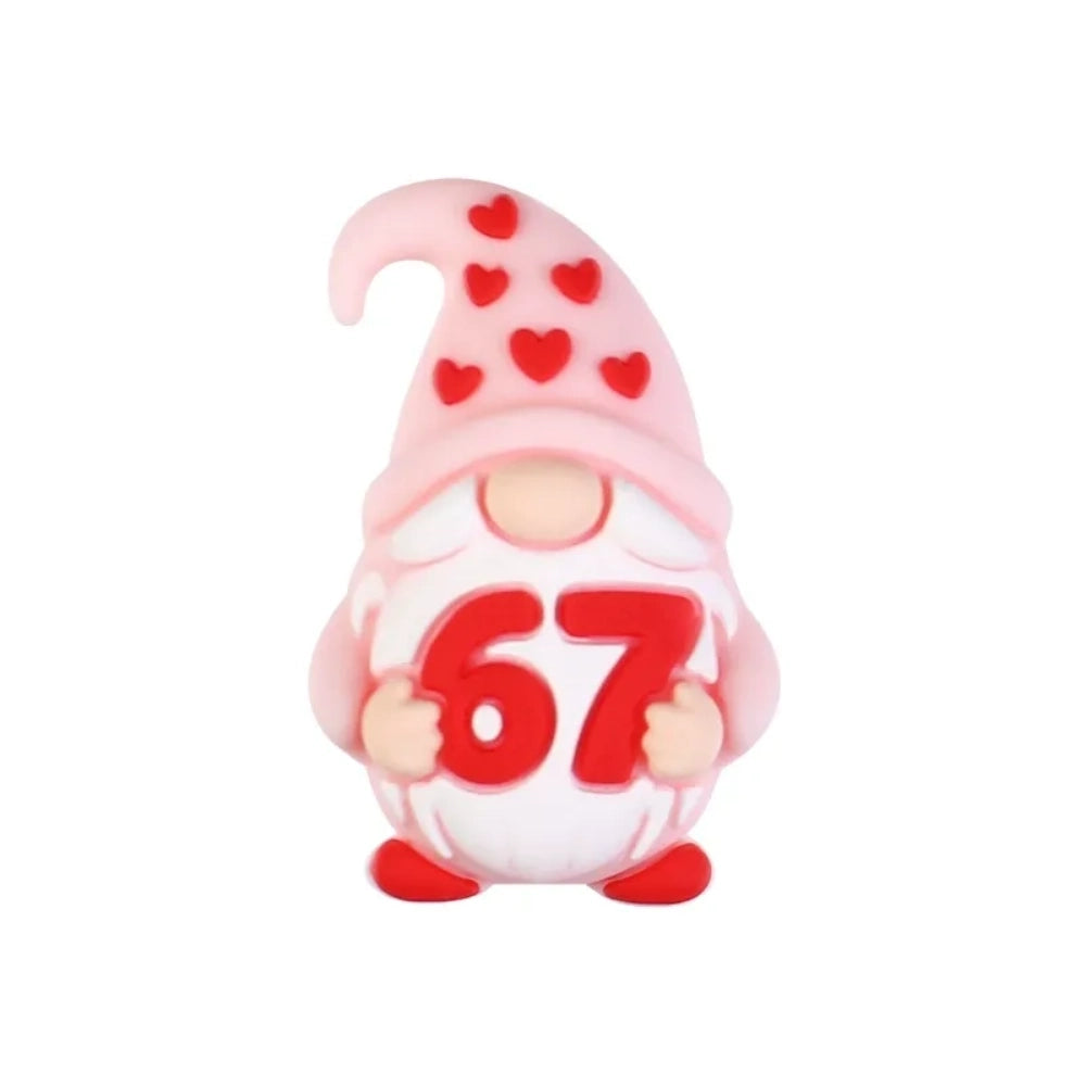 Assorted Valentine's Day silicone focal beads featuring teddy bears holding 67 hearts, highland cows with red bows, heart-shaped sunglasses, gnomes, and SIX SEVEN heart beads in red and pink tones - Gnome