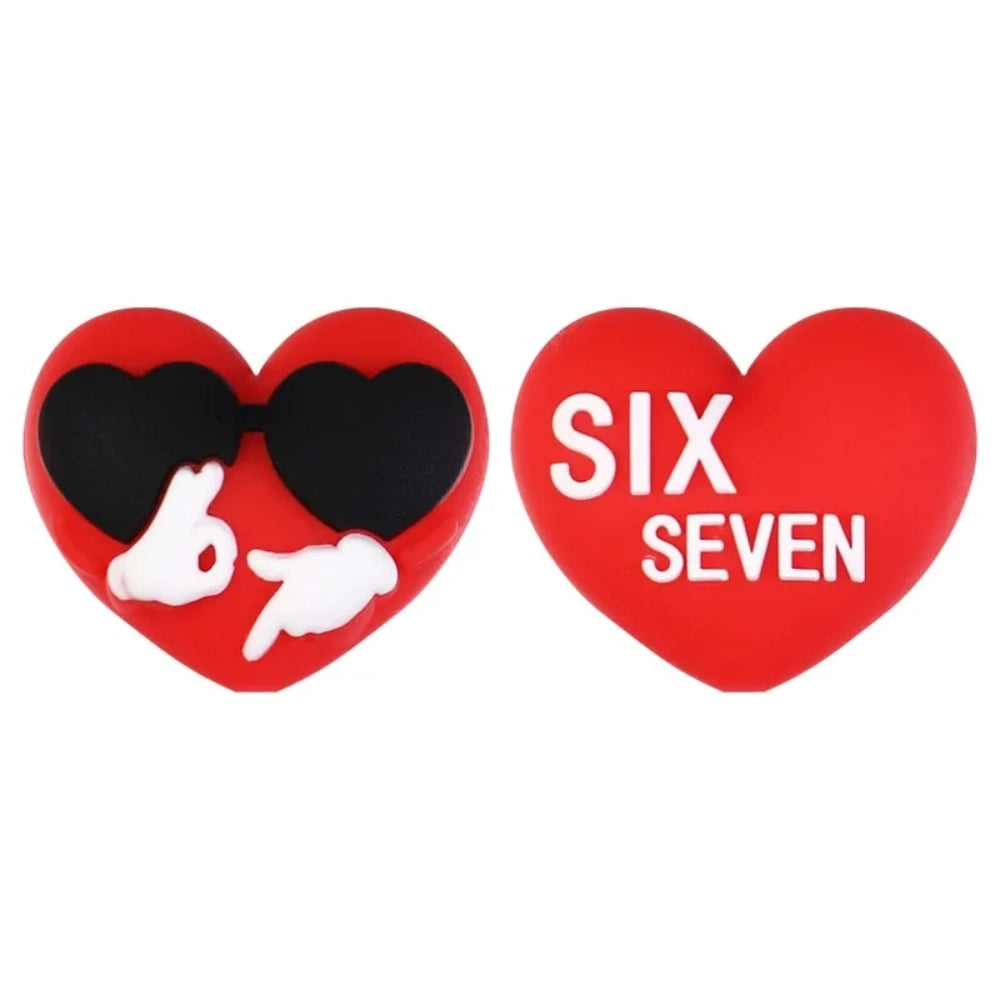 Assorted Valentine's Day silicone focal beads featuring teddy bears holding 67 hearts, highland cows with red bows, heart-shaped sunglasses, gnomes, and SIX SEVEN heart beads in red and pink tones - Heart