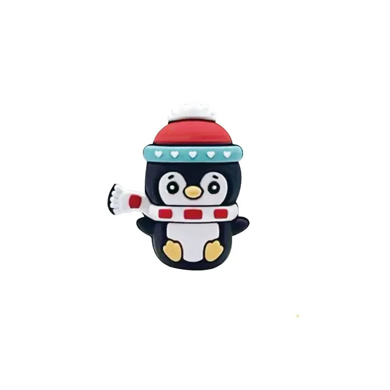 Cute 3D silicone focal bead shaped like a winter penguin wearing a red pompom hat and striped scarf, black and white with yellow feet, for DIY beadable pens and keychains.