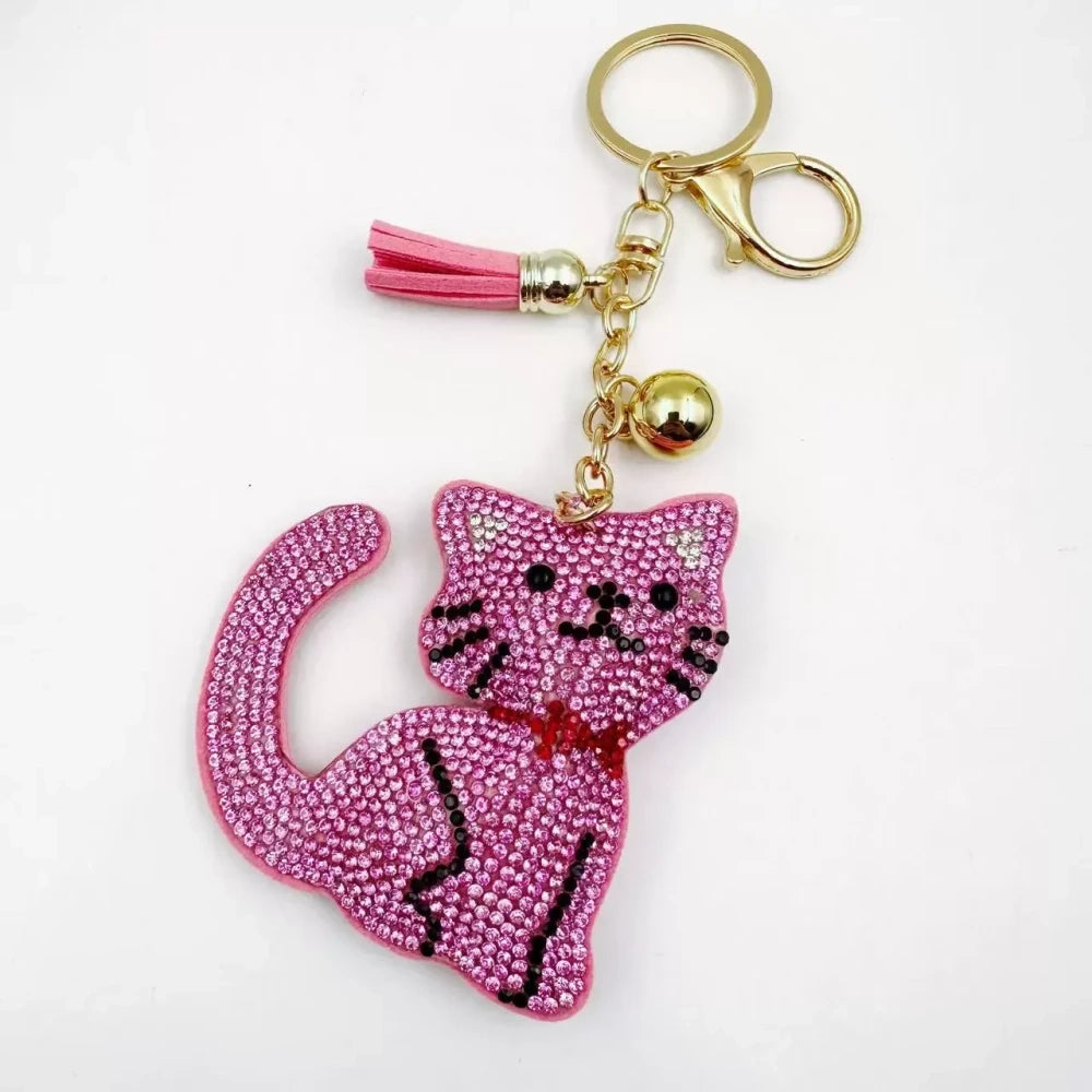 Black and white cat-shaped pave rhinestone fancy bead charms with gold-tone chain, tassels, and bow details. - 3