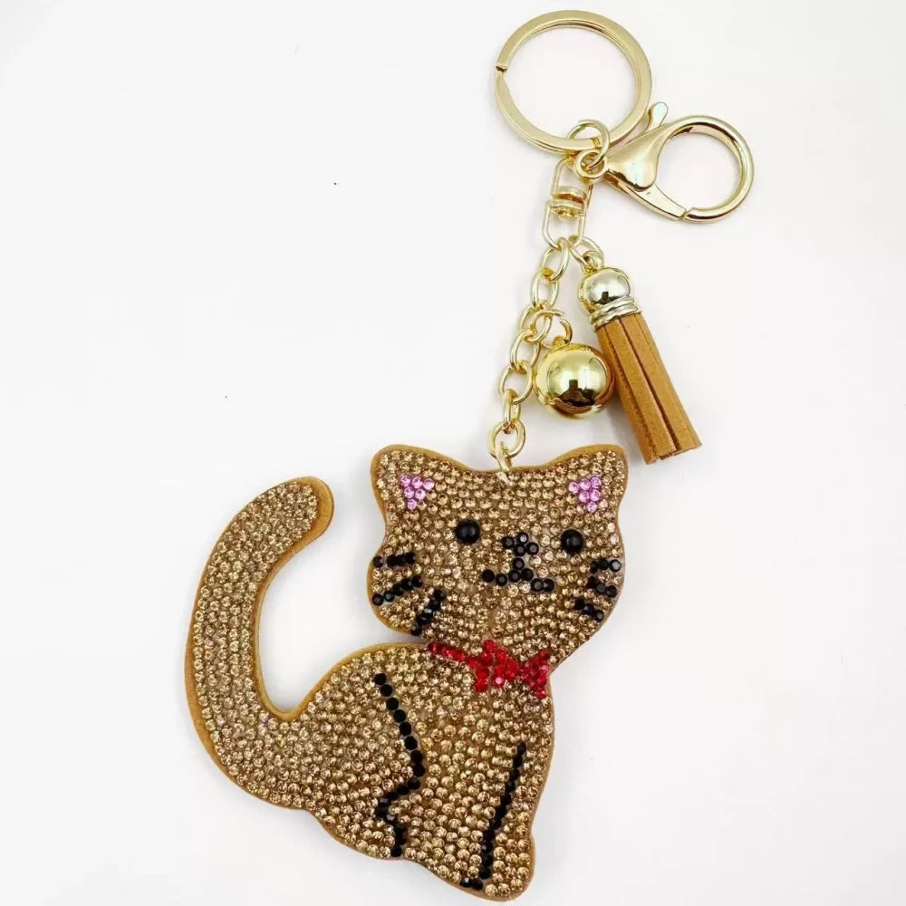 Black and white cat-shaped pave rhinestone fancy bead charms with gold-tone chain, tassels, and bow details. - 4