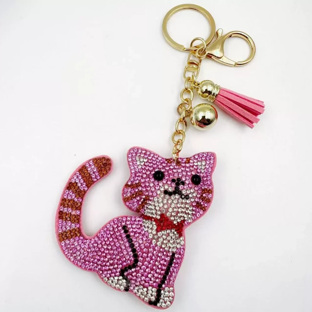 Black and white cat-shaped pave rhinestone fancy bead charms with gold-tone chain, tassels, and bow details. - 5