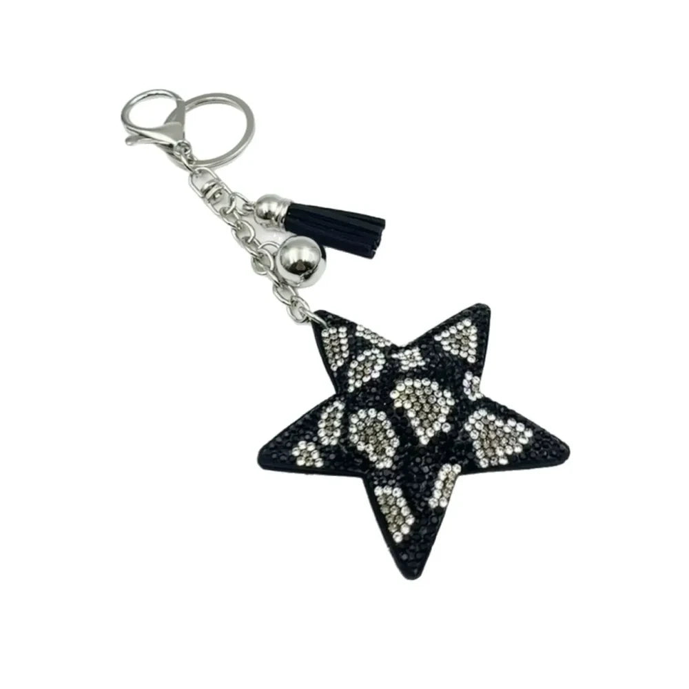 Five star-shaped leopard print rhinestone resin fancy beads in black, red, gold, and silver tones displayed as keychain-style craft pieces. - Black