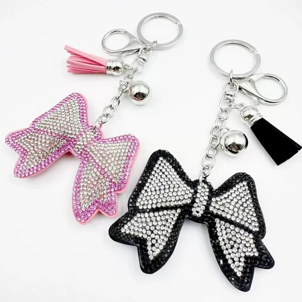 Pink and black bling bow rhinestone fancy beads with tassels, bell charms, and silver keychain hardware