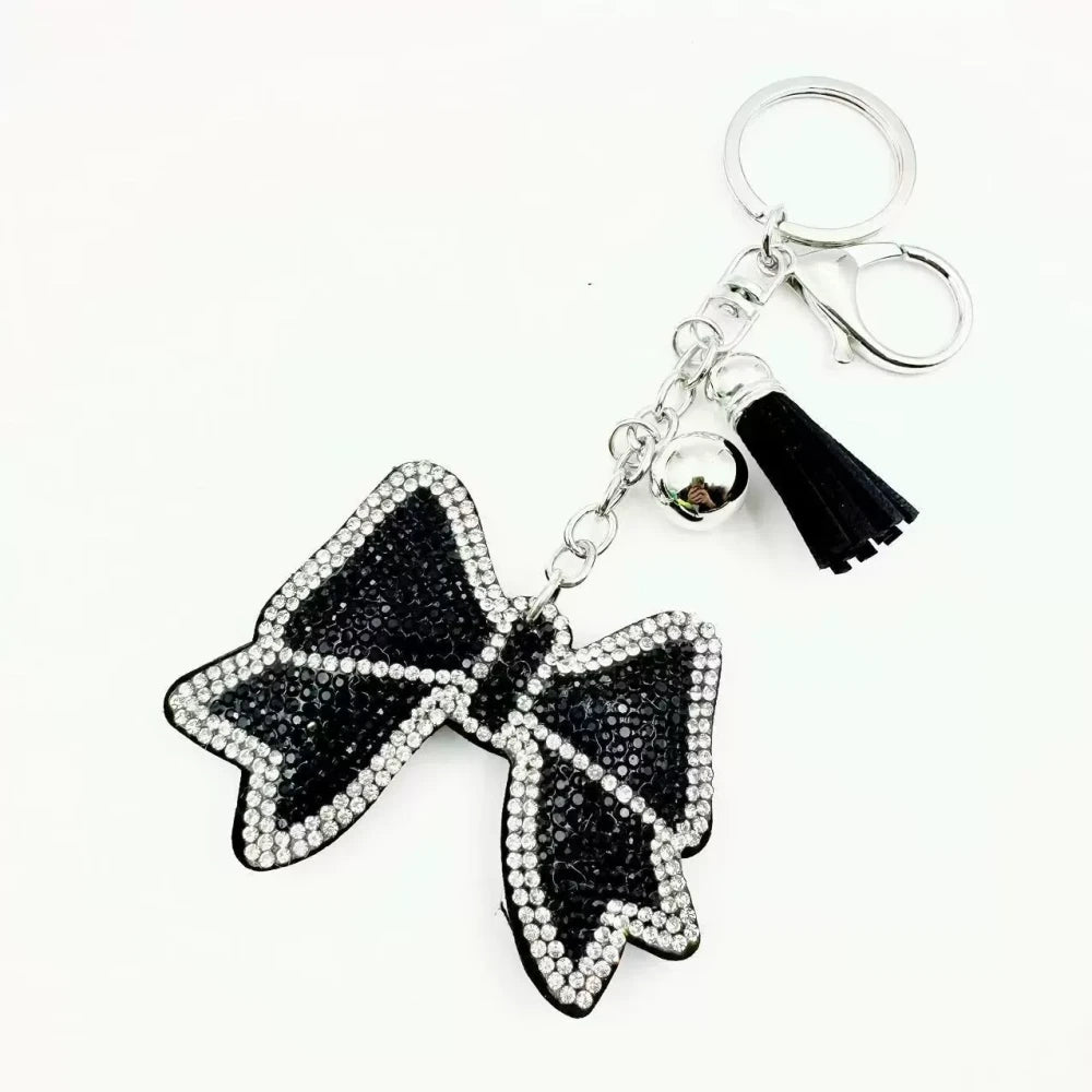 Pink and black bling bow rhinestone fancy beads with tassels, bell charms, and silver keychain hardware - Black
