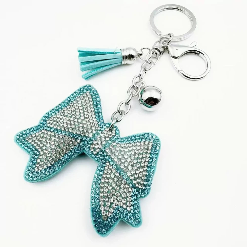 Pink and black bling bow rhinestone fancy beads with tassels, bell charms, and silver keychain hardware - Blue