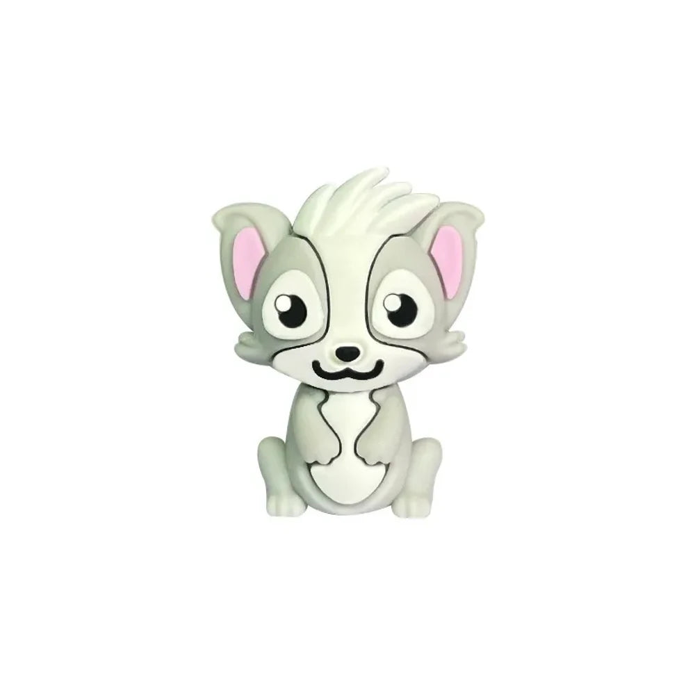 Three cute cartoon skunk silicone focal beads in gray, dark gray, and black colorways displayed on beadable pens with decorative silicone beads on a woven mat background. - Light Gray