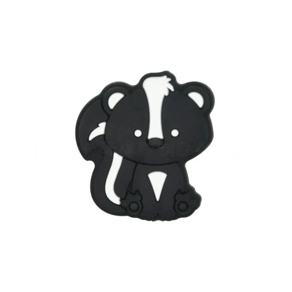 Two cute cartoon skunk silicone focal beads side by side — one black with white stripes and one gray with white stripes — for beadable pens and DIY crafts. - Black