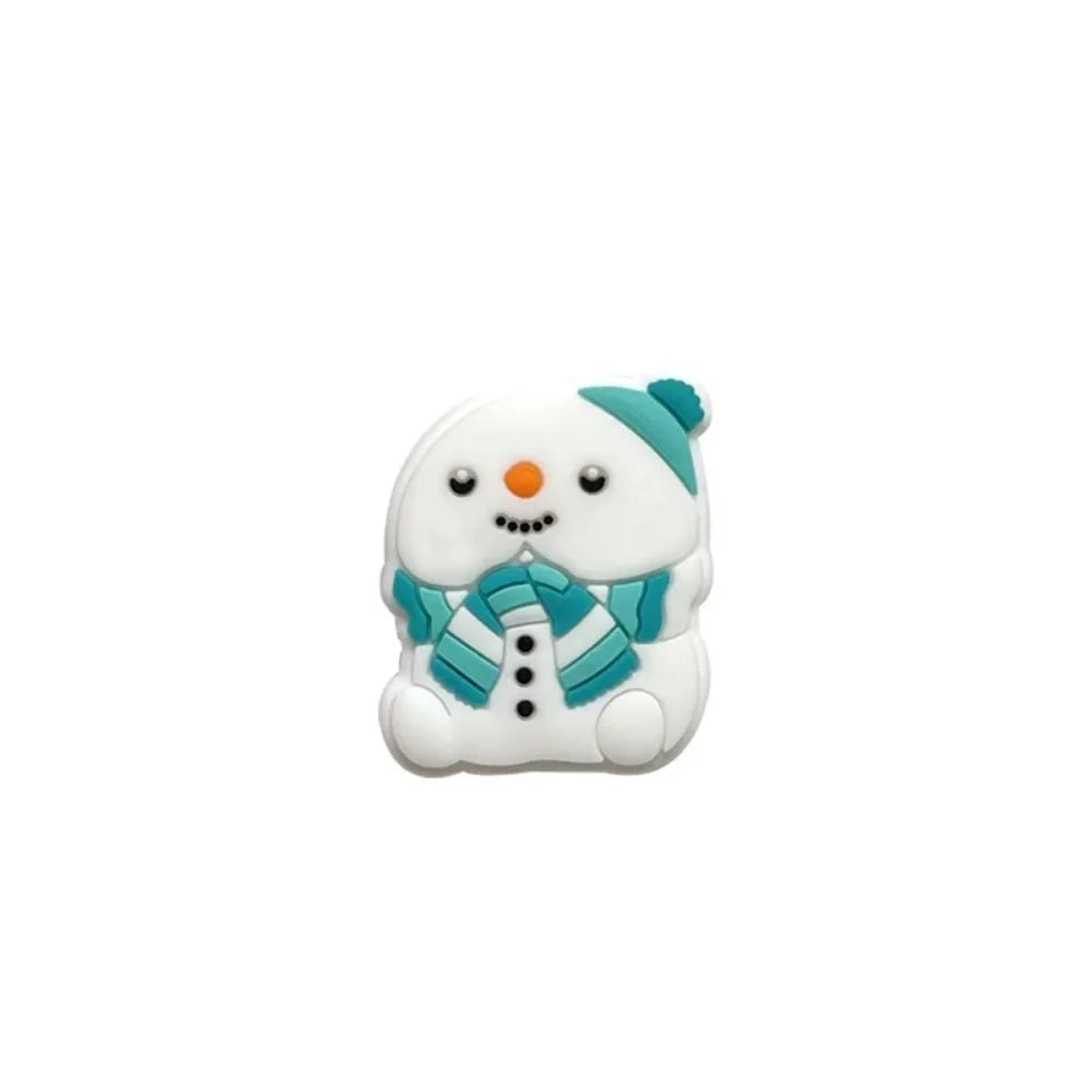 Five white silicone snowman focal beads wearing colorful striped scarves and knit hats in teal and red, displayed on a white pedestal with a blue background. - Green