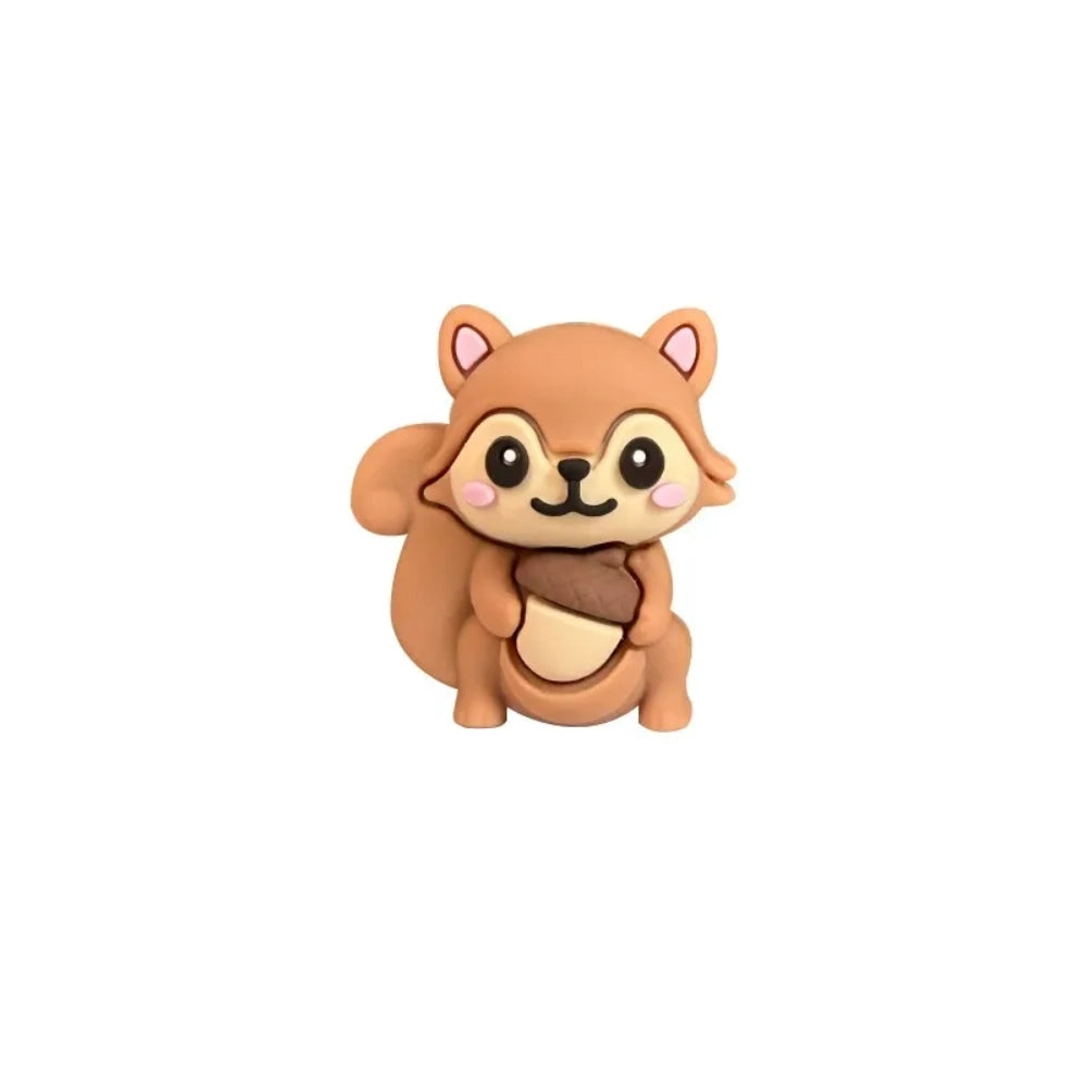 Five cute 3D squirrel silicone focal beads holding acorns in gray, pink, brown, dark gray, and red-brown colors displayed on decorative beadable pens against a pink background. - Camel