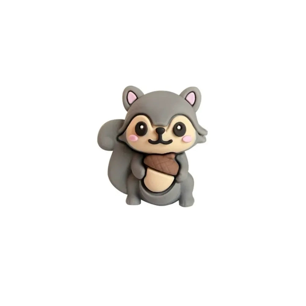 Five cute 3D squirrel silicone focal beads holding acorns in gray, pink, brown, dark gray, and red-brown colors displayed on decorative beadable pens against a pink background. - Dark Gray