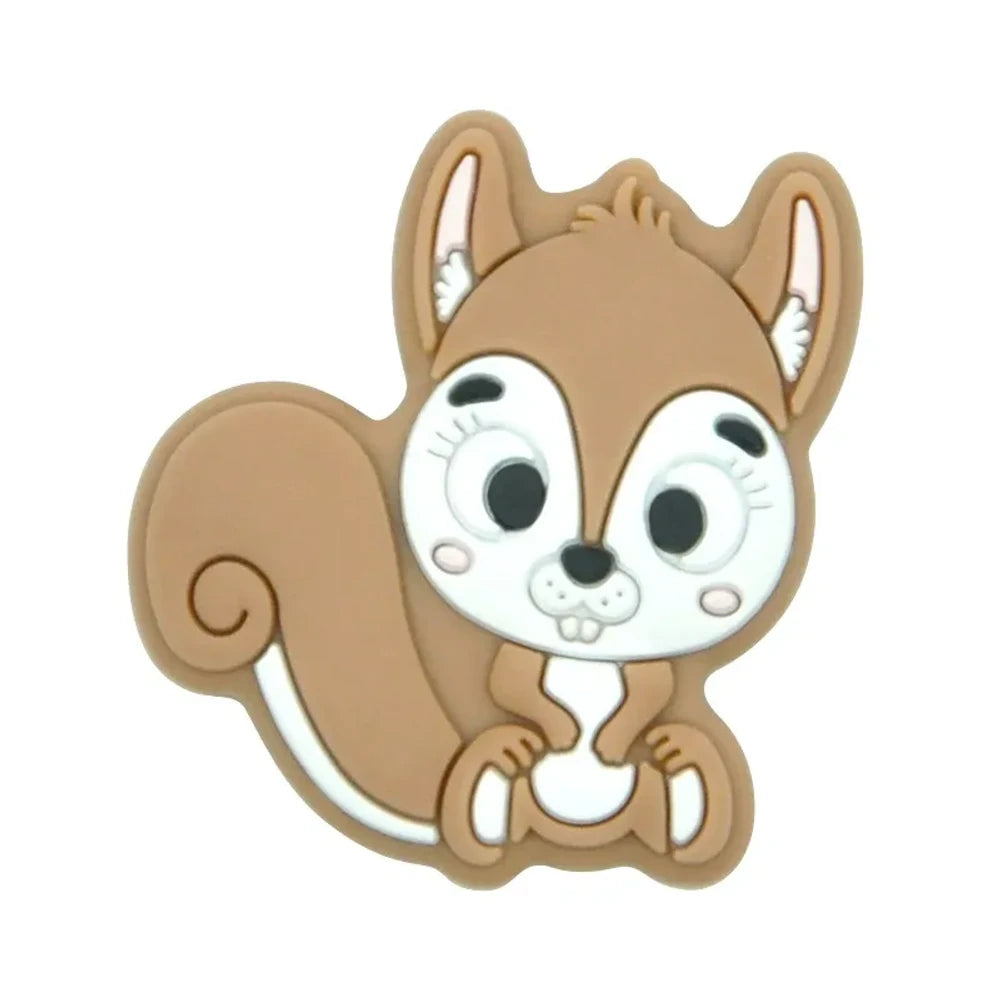 Ten colorful cartoon squirrel silicone focal beads in beige, pink, rose, mauve, brown, blue, green, gray, peach, and yellow arranged in two rows on a white background. - Camel