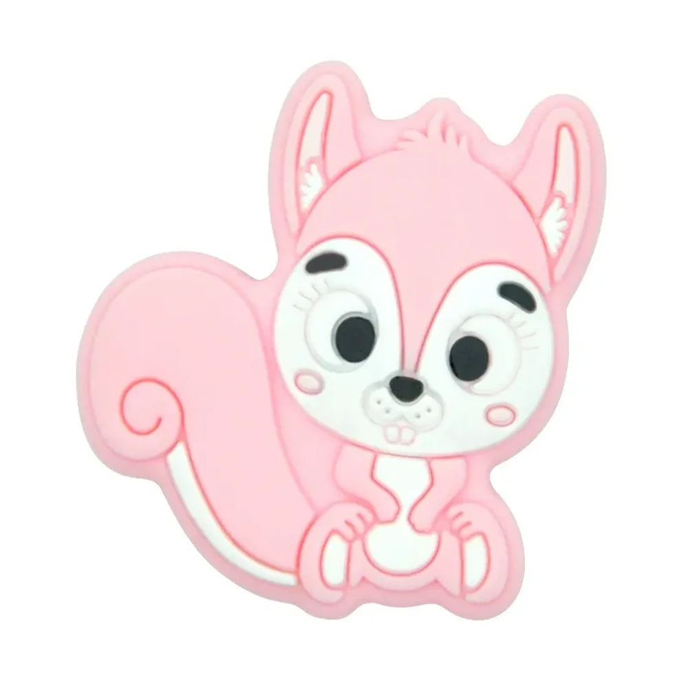 Ten colorful cartoon squirrel silicone focal beads in beige, pink, rose, mauve, brown, blue, green, gray, peach, and yellow arranged in two rows on a white background. - Candy Pink