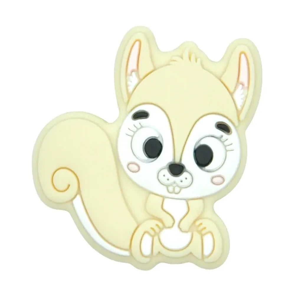 Ten colorful cartoon squirrel silicone focal beads in beige, pink, rose, mauve, brown, blue, green, gray, peach, and yellow arranged in two rows on a white background. - Creamy White