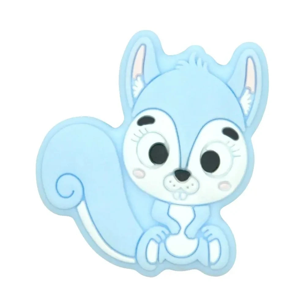Ten colorful cartoon squirrel silicone focal beads in beige, pink, rose, mauve, brown, blue, green, gray, peach, and yellow arranged in two rows on a white background. - Light Blue