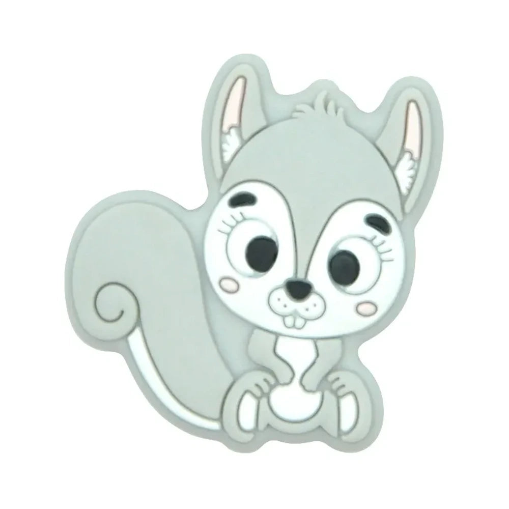 Ten colorful cartoon squirrel silicone focal beads in beige, pink, rose, mauve, brown, blue, green, gray, peach, and yellow arranged in two rows on a white background. - Light Gray