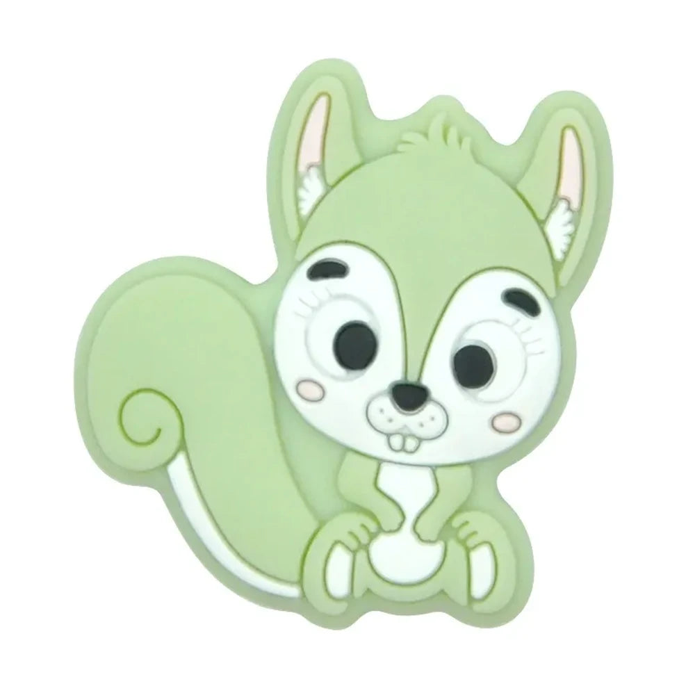 Ten colorful cartoon squirrel silicone focal beads in beige, pink, rose, mauve, brown, blue, green, gray, peach, and yellow arranged in two rows on a white background. - Matcha Green
