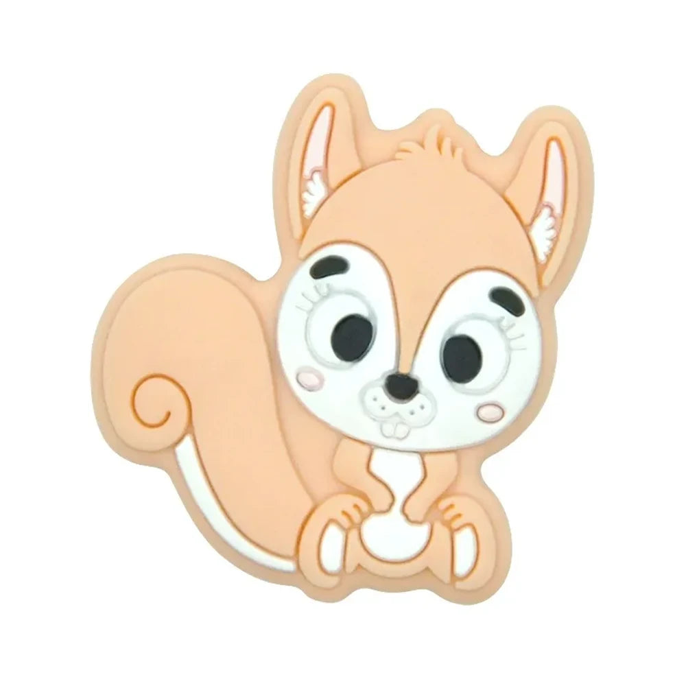 Ten colorful cartoon squirrel silicone focal beads in beige, pink, rose, mauve, brown, blue, green, gray, peach, and yellow arranged in two rows on a white background. - Orange