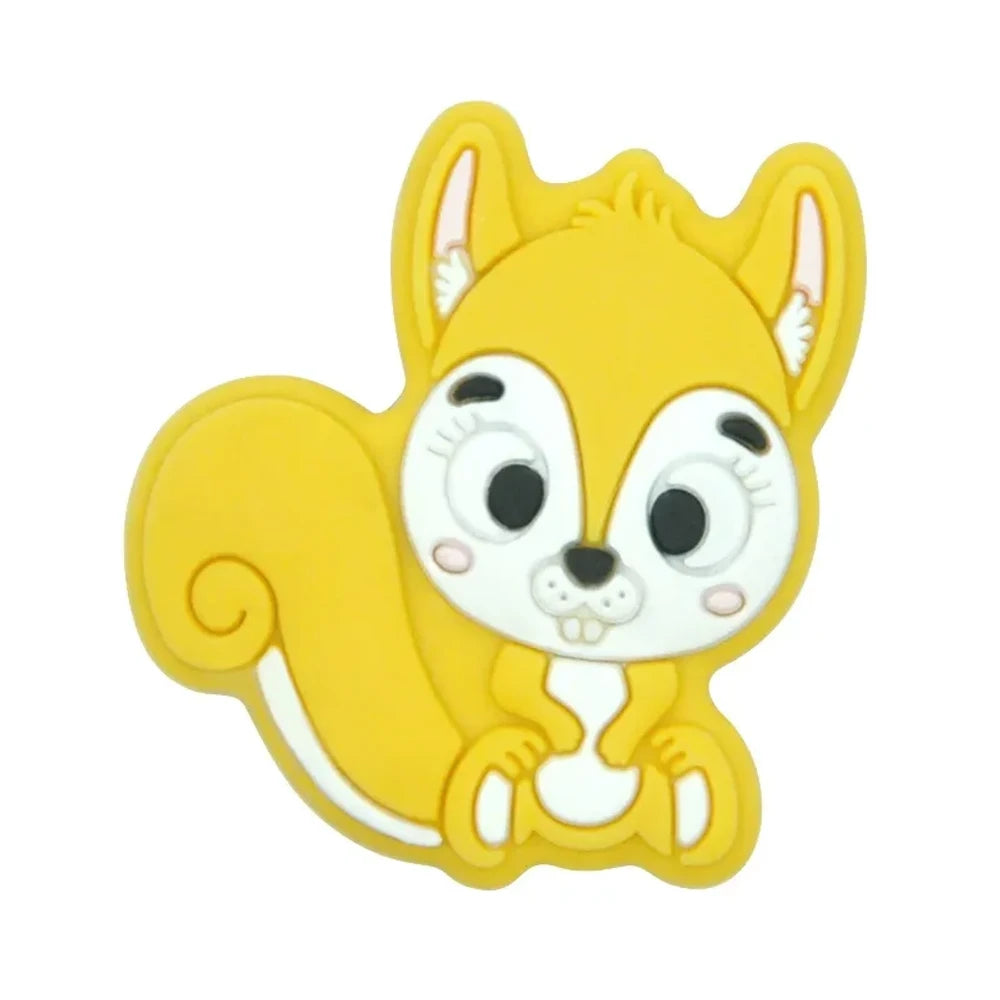 Ten colorful cartoon squirrel silicone focal beads in beige, pink, rose, mauve, brown, blue, green, gray, peach, and yellow arranged in two rows on a white background. - Yellow