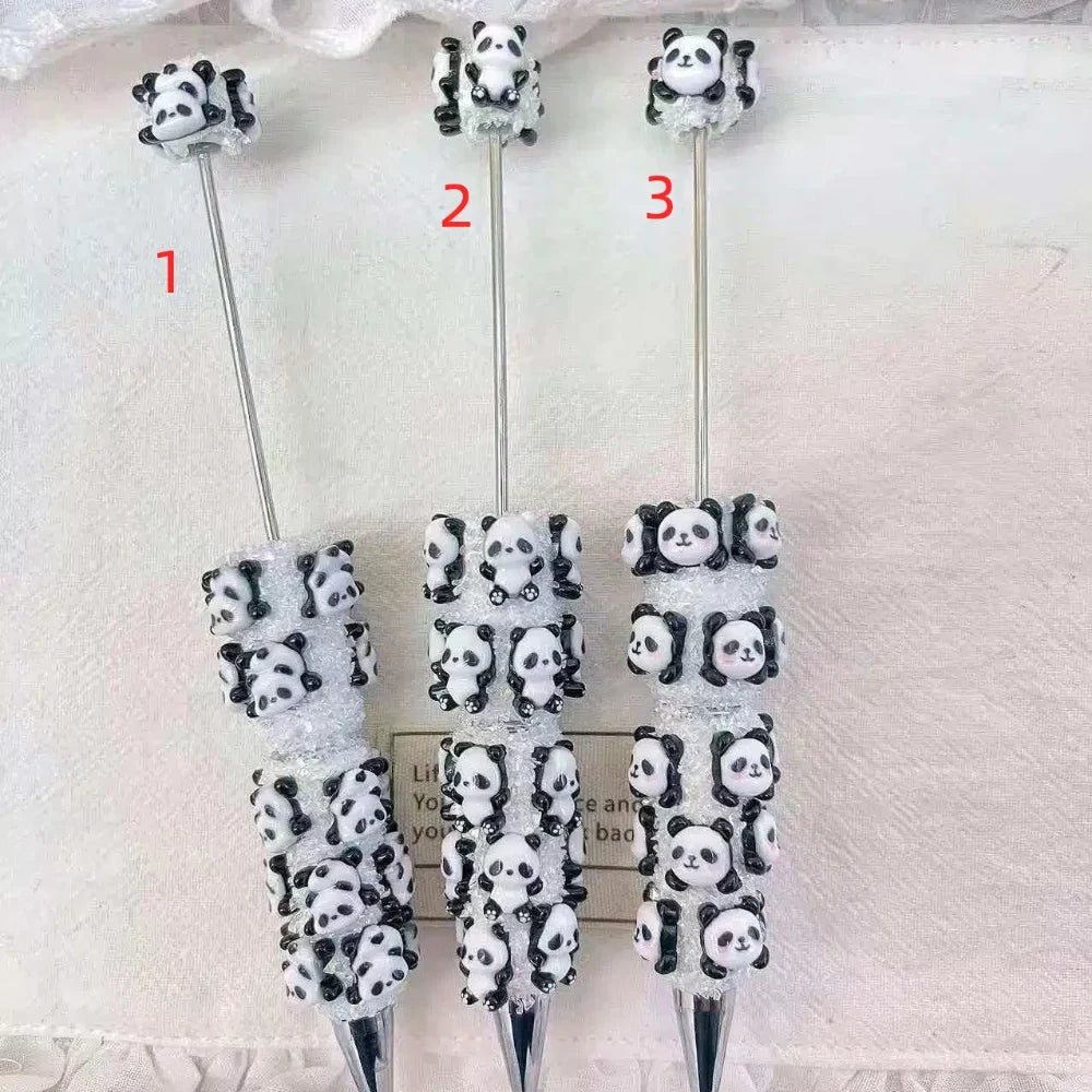 Three black and white cute panda rhinestone pens in three style options on a white background.