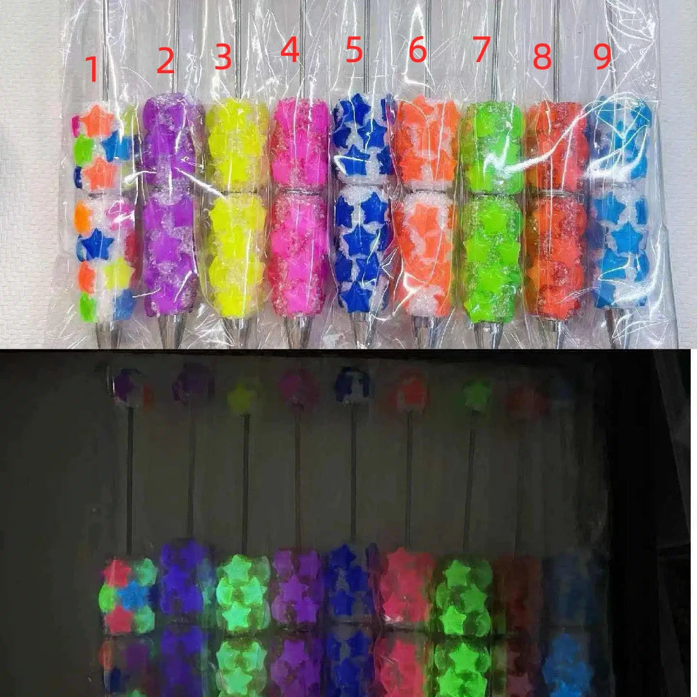 9 neon UV glow star-shaped rhinestone beadable pens in assorted colors including purple, yellow, pink, blue, orange and green, shown in normal light and glowing under UV black light.