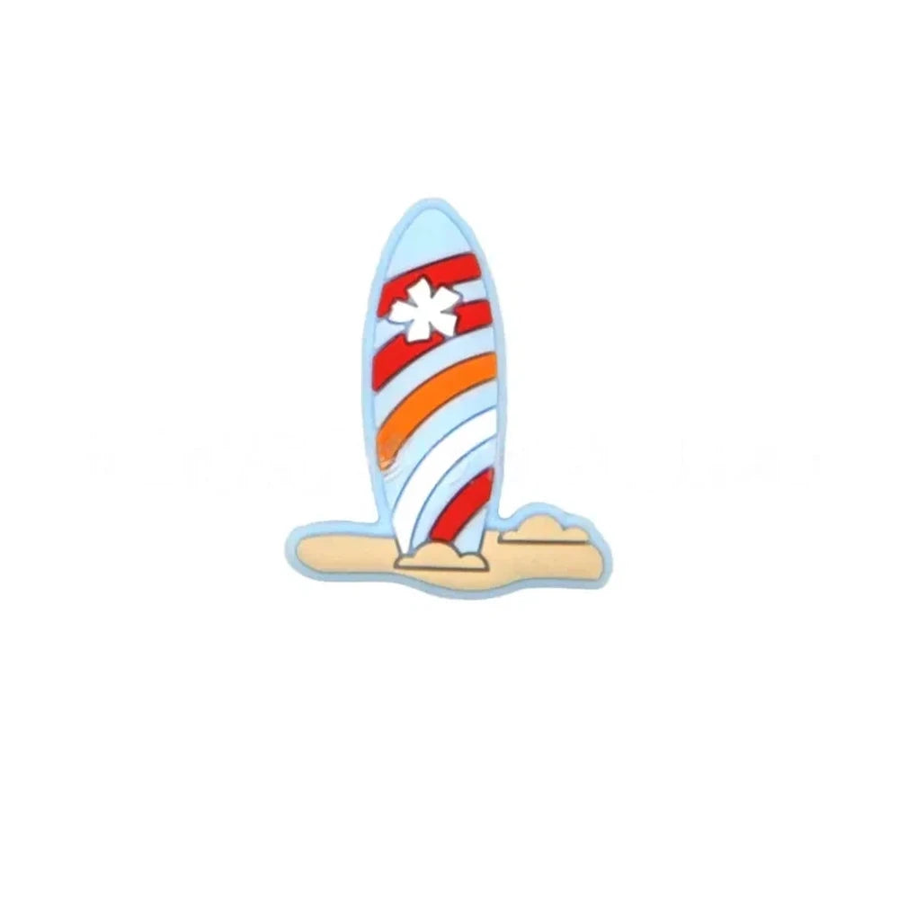 Colorful striped surfboard silicone focal beads in blue and white with flower detail, displayed in a white shell-shaped dish on a light blue background. - Blue