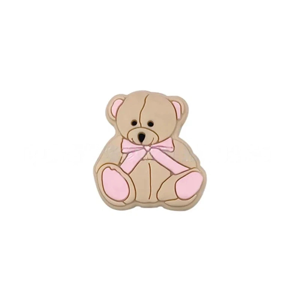 Six teddy bear silicone focal beads in white, tan, pink, mint, blue, and gray, each with a bow tie accent, displayed on a white background for DIY craft projects. - Creamy White