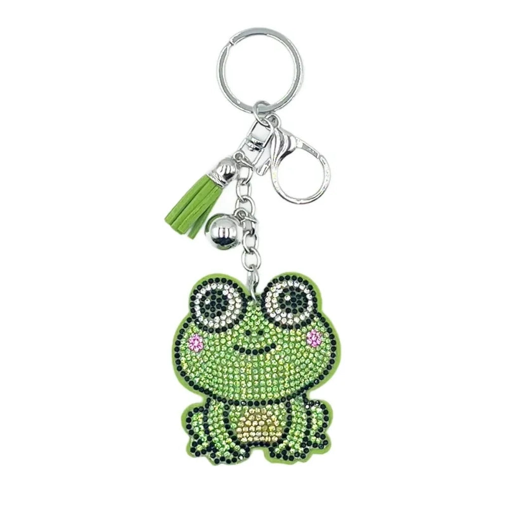 Green frog rhinestone charm with silver keyring, clasp, bell, and green tassel
