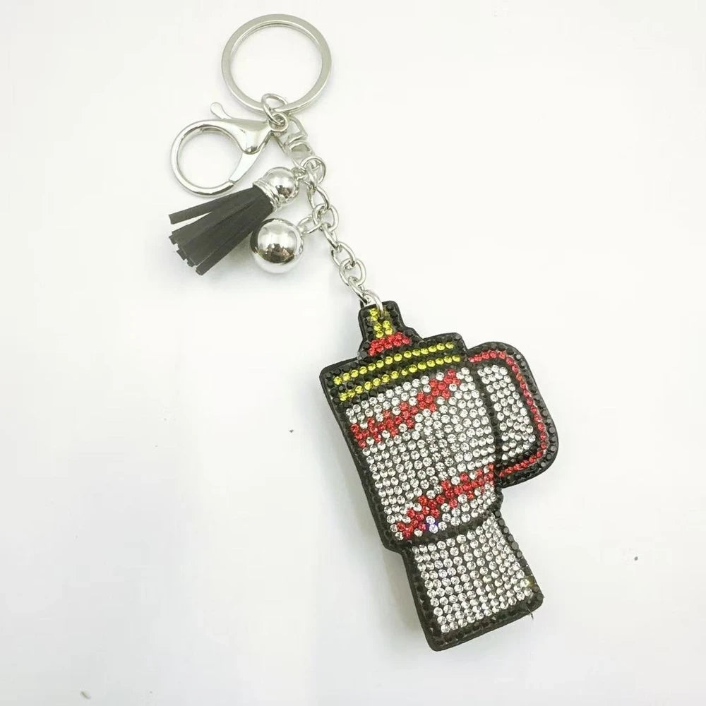 Three moka pot coffee maker rhinestone fancy beads in orange, white, and brown with tassels and silver keychain clasps. - 1
