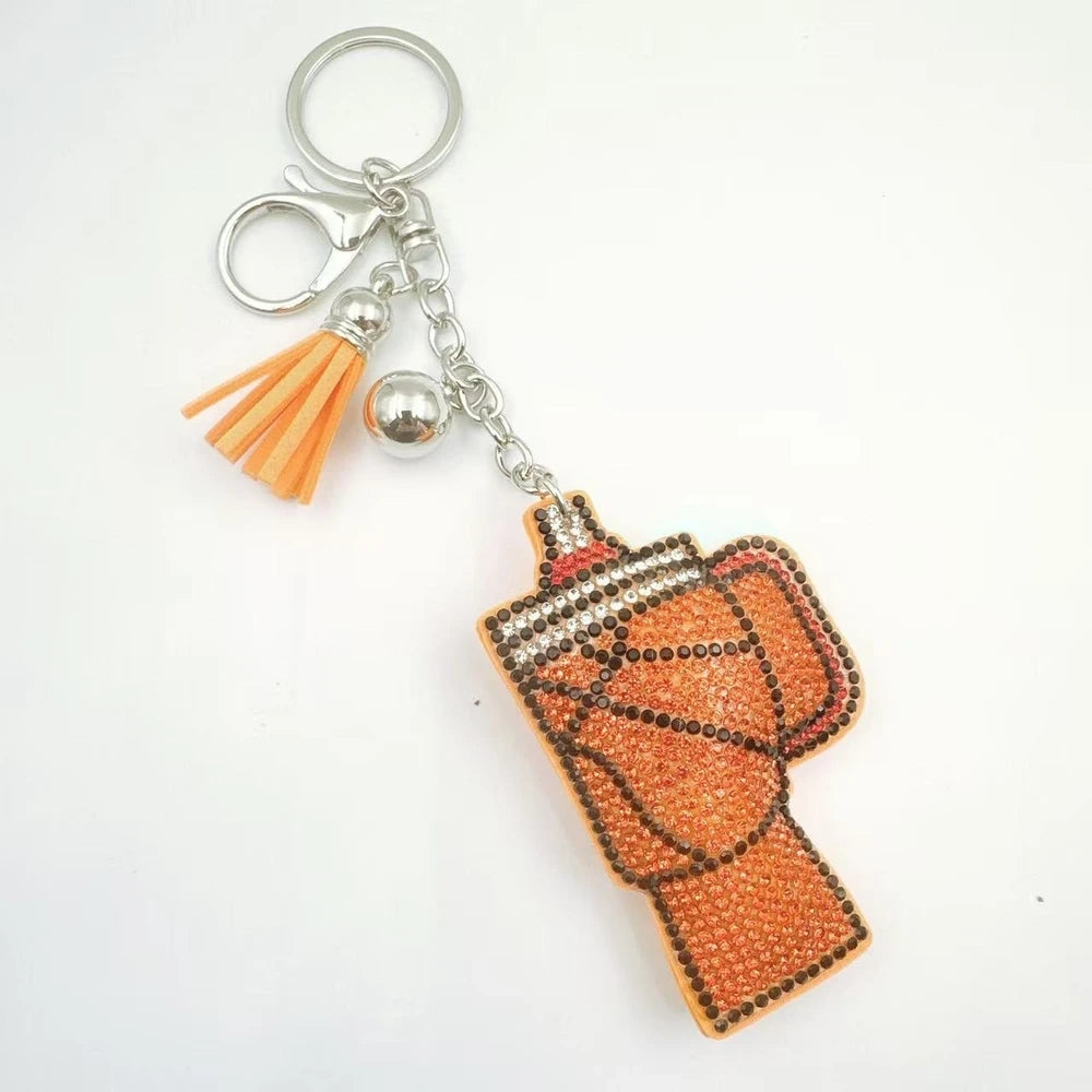 Three moka pot coffee maker rhinestone fancy beads in orange, white, and brown with tassels and silver keychain clasps. - 2