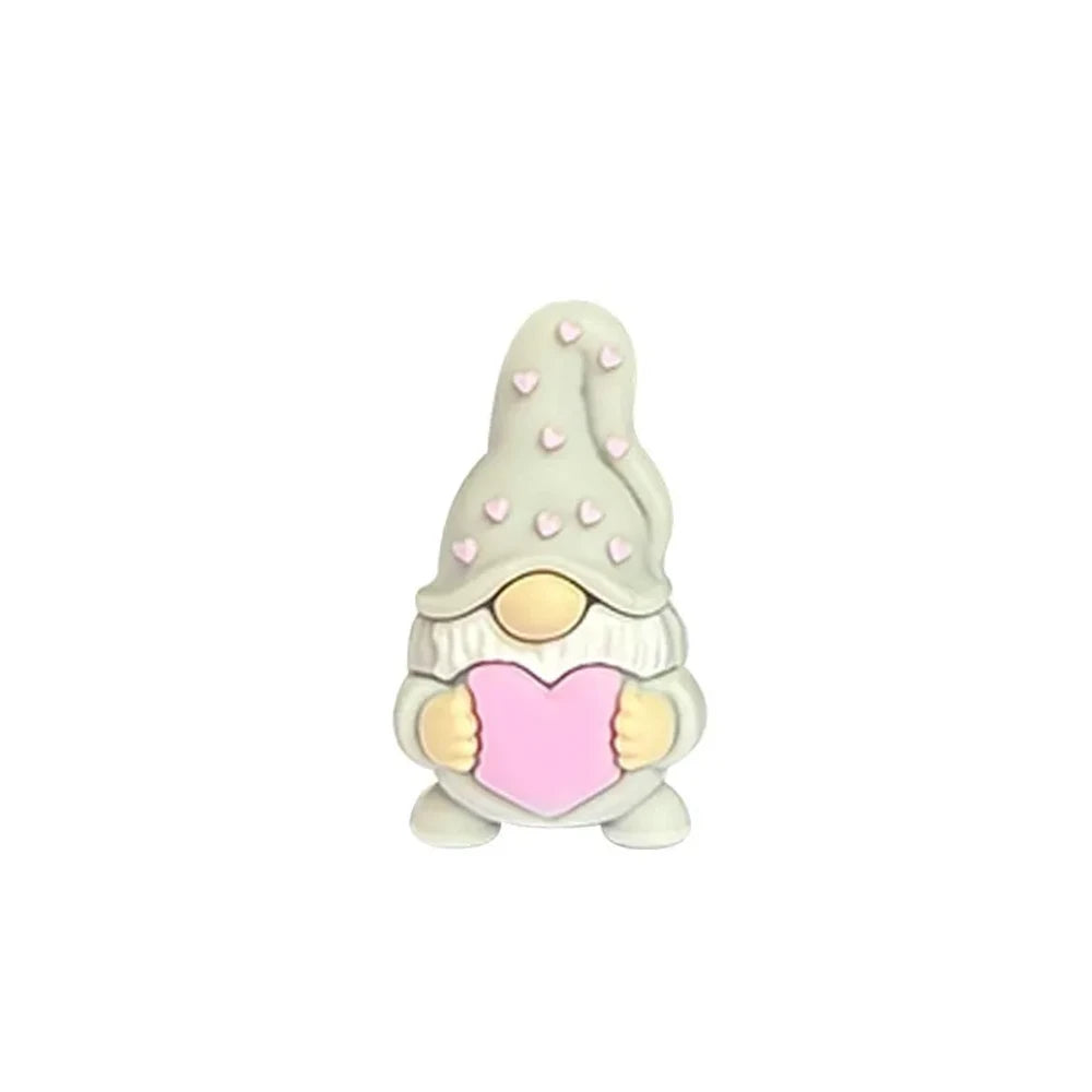 Assorted Valentine gnome silicone focal beads in red, pink, gray, and burgundy holding pink hearts, displayed on a white cloud tray with beadable pens below. - Light Gray