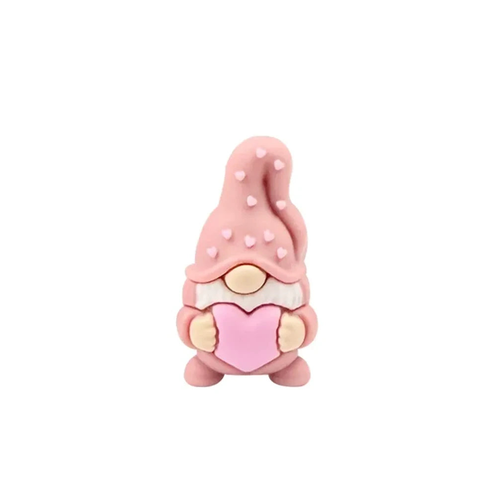 Assorted Valentine gnome silicone focal beads in red, pink, gray, and burgundy holding pink hearts, displayed on a white cloud tray with beadable pens below. - Light Pink