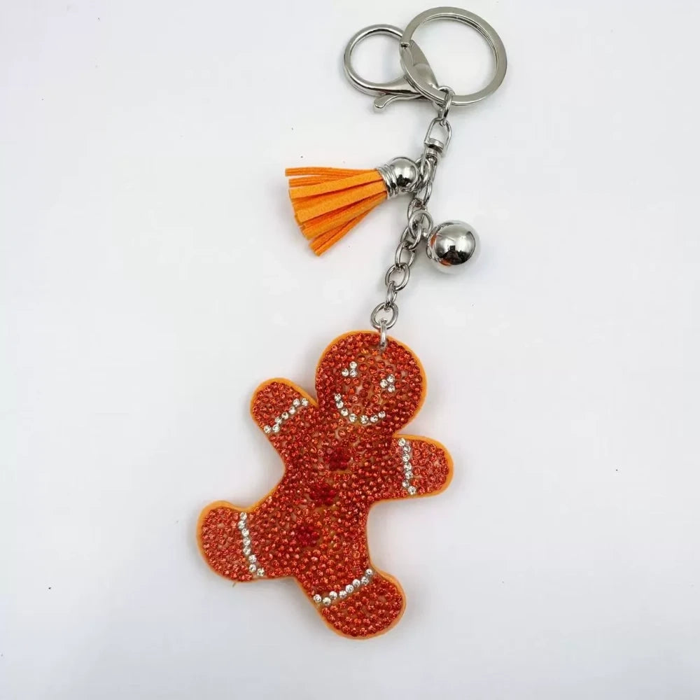Three rhinestone gingerbread figure keychain charms in brown, pink, and orange with tassels and silver clasp rings - 4